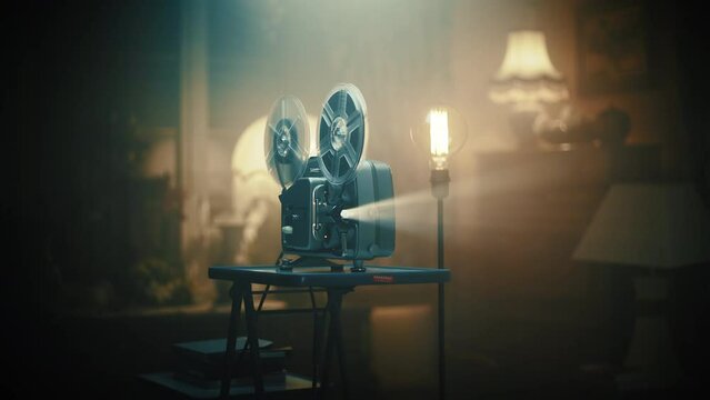 Old black movie projector on the blurred empty background