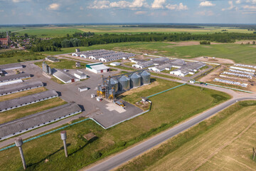 aerial panoramic view over silos and rows of barns, pigsties, chicken coops of huge agro-industrial livestock complex © hiv360