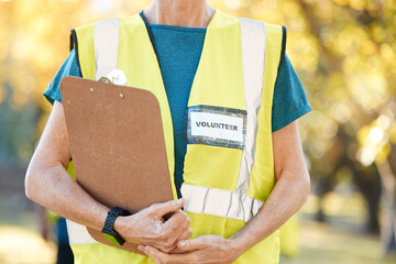 Clipboard, volunteering and person in park for cleaning, community service and pollution or...