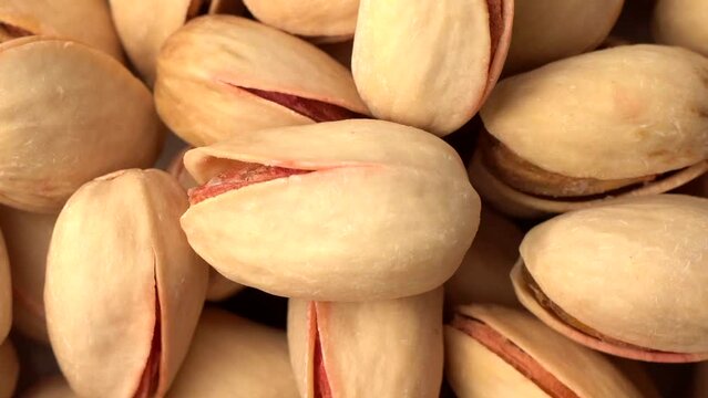 Closeup of a bunch of spinning organic pistachio