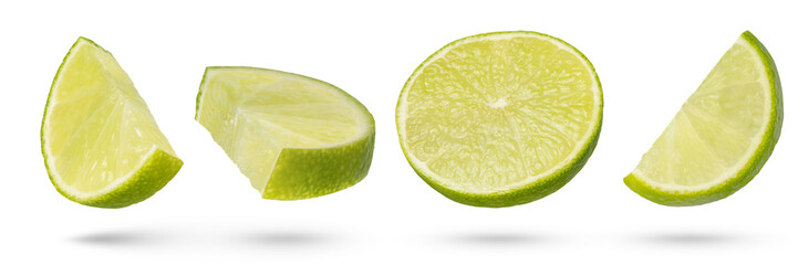 Lime slices on a white isolated background. Lime slices of different ways of cutting from different sides close-up. Suitable for advertising banner or packaging label.