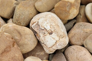 Fototapeta na wymiar Pile of yellowish stones arranged in a pile