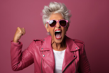 Senior woman looking happy and joyful full of energy. doing rock poses in front of a seamless background. Generative AI