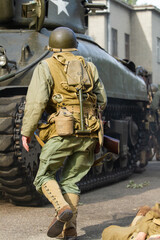 Historical reconstruction. An American infantry soldier from the World War II  prepare to attack...