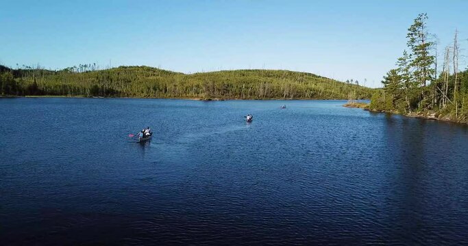 Drone following Canoes on a River