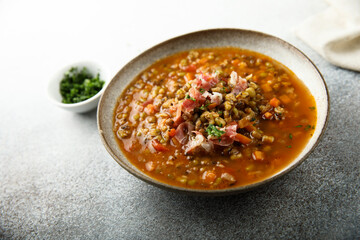 Homemade lentil soup with smoked bacon