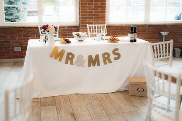 Beautiful wedding table setup with vibrant floral decorations.