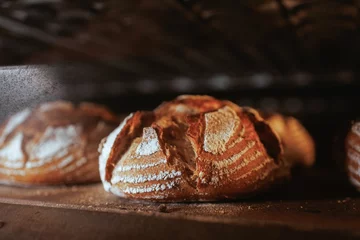 Papier Peint photo autocollant Boulangerie Closeup of crusty bread baking in the oven