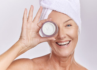 Portrait, cream and beauty with old woman, happy with skincare and dermatology on white background....