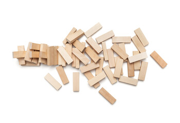 Concept of risk and destruction -A pile of small wooden blocks from a collapsed tower on a white...