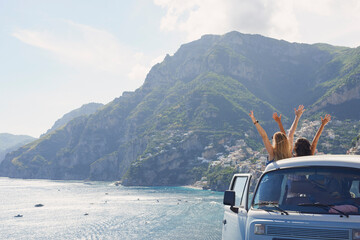 Car, back view and women at ocean for freedom, vacation and summer travel in Italy. Road trip, van...