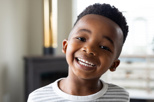 Portrait of happy african american boy looking at camera and smiling