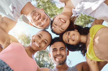 Diversity, group huddle for teamwork and happy together outside with a lens flare. Portrait or support, community or motivation and face of friends smile for summer holiday or vacation outdoors