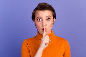 Portrait of young person finger touch lips demonstrate shh gesture isolated purple color background