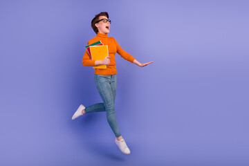 Full body photo of young student girl jumping up hold school university library book diary planner organizer