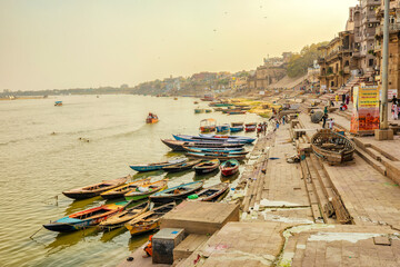 Boats on Ganges river and Varanasi ghats in early morning, Varanasi, India