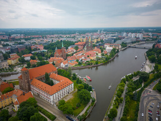 Fototapeta na wymiar Wroclaw, a city in the Lower Silesian Voivodeship on a sunny day. The most visible tourist places and locations in Wrocław from a bird's eye view from a drone.