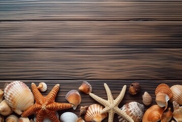 Top view of sea shells and starfish on wooden table for background