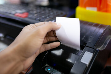 Hand pull and tear paper on Mobile Printer, Finance Concept.