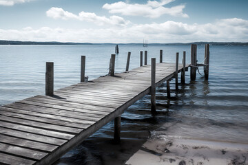Tranquil Coastal Escape: A Scenic Landscape Featuring a Weathered Pier and Gentle Seaside Waves, ai generative