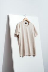  Beige t-shirt on wooden hanger, tshirt mockup