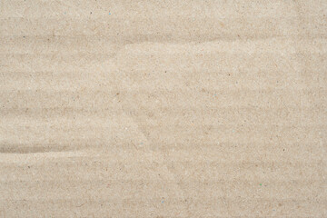 Cardboard texture. Brown cardboard background. Empty crumpled cardboard with surface texture. Cardboard sheet of paper