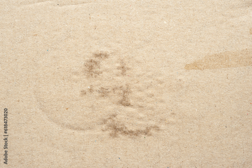Poster cardboard texture with wet patches. brown cardboard with round wet spots of water. crumpled cardboar