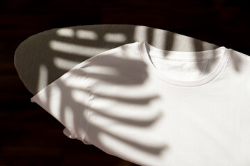  White t-shirt on ironing board, home interior