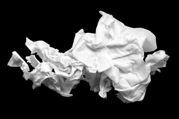 Wet wrinkled paper. Crumpled sheet of wet paper on a black background. Selective focus