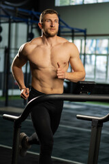 Obraz premium Male athlete running on a treadmill
