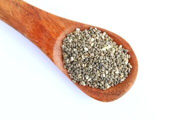 Chia seeds in a wooden spoon on white background 