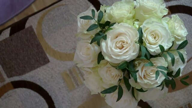 Beautiful modern bridal bouquet of fresh white roses. Flowers arrangement for celebration.