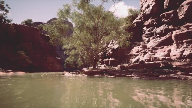 landscape with red sandstone rock and river