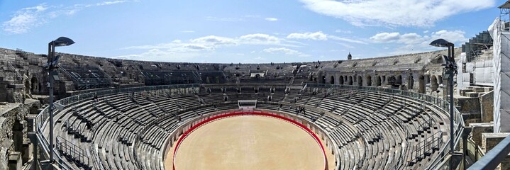 Nîmes, May 2023 : Visit the beautiful city of Nîmes en Provence - Historical city with its arena and ancient theater - View on the arena	
 - obrazy, fototapety, plakaty