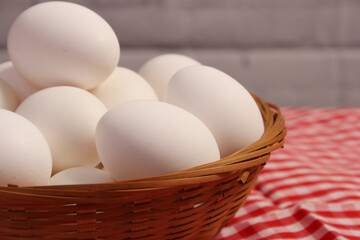 Basket of Farm Fresh Eggs on Red and White Checkered Fabric