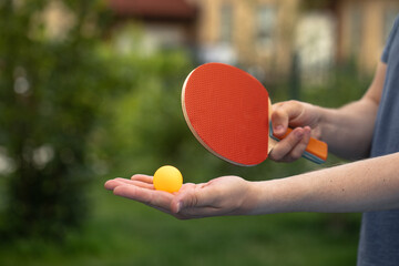 table tennis player doing a serve, close-up, The concept of sport and healthy lifestyle.