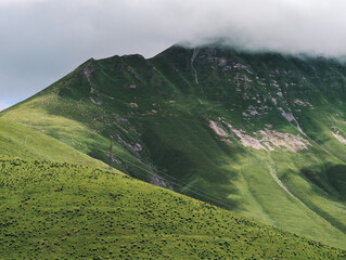 Clouds and sunlight in the green mountains