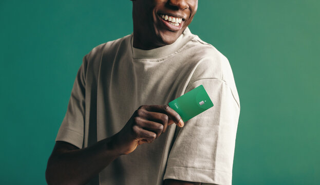 Cashless convenience: Young black male banking with a credit card