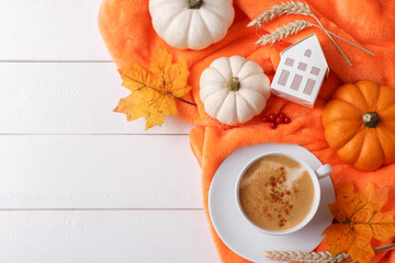 Autumn background with coffee latte and pumpkins