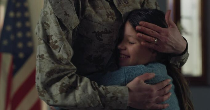 Slow Motion Portrait of Little Girl Running to her Mother's Arms After She Came Back from a Military Mission. The Daughter of a Female USA Soldier Missing her Mother, Hugging her, Happy for her Safety