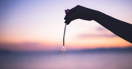 hand holding fireworks