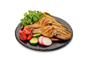 Fried chicken drumsticks served with grilled eggplants, isolated on white background.