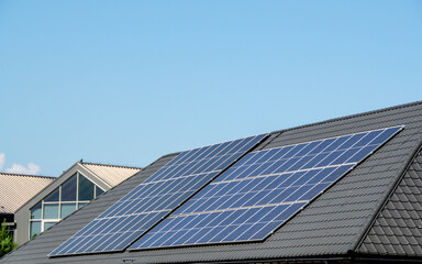 Fototapeta na wymiar House roof with photovoltaic modules.
