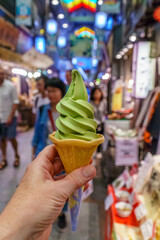 Close up of green matcha ice cream cone also known as green tea ice cream