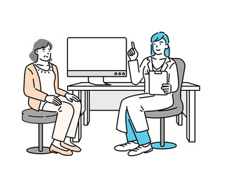 A woman being seen by a doctor in a hospital