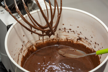 woman preparing brownie in a mixer. homemade chocolate brownie