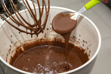 woman preparing brownie in a mixer. homemade chocolate brownie