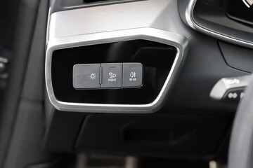 Panel with buttons for controlling the operating modes of car headlights
