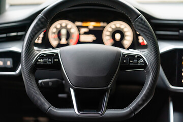 Control buttons on the steering wheel of the car - obrazy, fototapety, plakaty