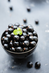 black currants in a black bowl